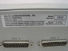 Bravo Communications CPS/1000 Model 1042 FCC label showing Model Number 1042, Serial Number 2451, FCC ID FWI4R01042, Made in USA