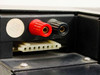 Digital Equipment DEC H775-BA battery compartment close-up showing red and black binding post terminals and white multi-pin connector
