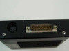 Black Box AC223A KVM Remote Module – left side showing Mini-DIN 6-pin keyboard port and DB25 connector with dust and light oxidation on pins