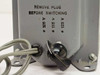 Close-up of voltage selector switch showing 105V, 115V, and 125V positions with 'Remove Plug Before Switching' instruction label