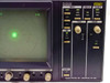 Magni VS561 Vectorscope front panel close-up showing INPUT (CH A, CH B, CH C), DISPLAY (VEC, AUD), FORMAT (CPST, YPbPr, GBR), GAIN and PHASE knobs, REF selector, and REMOTE section with Magni Systems Inc. Beaverton OR USA label