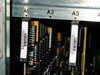 Octel VMX200 close-up of card slots A1, A2, and A3 showing installed cards with barcode labels including part number 300-6032-001