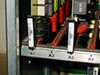 Octel VMX200 card slot bottom-edge view showing slots A1 through A4 with yellow and red jumper/connector components visible on card edges