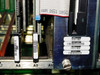 Octel VMX200 interior view of card slots A7–A10 showing card labels including 300-6002-114, ribbon cable connector AWM 2651 105C, and floppy drive module at A10 position