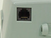 Close-up of RJ-style serial communication port on side of Zebra Eltron PA202 XPort printer