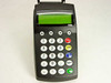 Banksys C-ZAM Smash Merchant Unit – direct front view showing full keypad layout with STOP, CORR, MENU, and OK function keys and backlit LCD