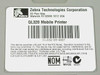 Zebra QL320 mobile printer manufacturer label showing model name and FCC compliance information