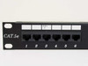 Dynacom CAT 5e patch panel – close-up of front left ports 1–6 with CAT.5e branding and port labeling strip
