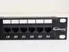Dynacom CAT 5e patch panel – close-up of front right showing Dynacom logo and ports 19–24