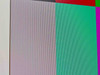 Close-up of ADI MicroScan A508 screen surface showing color bars and a visible vertical scratch near the left side of the display