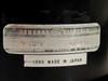 Close-up of GE General Electric label on GL-132 lens body showing '7 to 1', model GL-132, and 'Lens Made in Japan' sticker