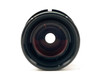 General Electric GS-028 projector lens front element view showing multi-coated red-tinted glass and lens barrel interior