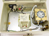 ISA Riber CX 700 enclosure interior open view showing Legrand DERI 150VA autotransformer, wiring harness, flow meter mechanism with brass fittings, and circular dial assembly
