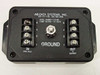 AC Data Systems TJ1010B top label showing model number TJ1010B and clamp voltage 10 volts with screw terminal blocks and ground stud