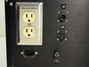 Rear panel detail showing isolated ground duplex outlet, IEC inlet, J5 and J6 XLR connectors, and 15A fuse holder