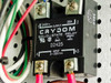 Close-up of Crydom D2425 solid-state relay showing 240V output, 25A rating, 3-32V DC input, assembled in Mexico
