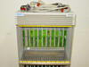 Rolm 9200 PBX chassis – close-up of top shelf bay showing green circuit boards installed and dense backplane connector strip