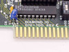 Diamond IO DIO-100 Rev C close-up of PCB silkscreen label and ISA edge connector gold fingers, with Lattice PLHS18P8AN IC visible