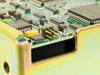 Seagate ST41200NM PCB corner closeup showing surface-mount components, yellow tantalum capacitor, and jumper configuration header