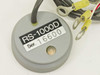 Hitachi RS-1000D Sensor Head close-up of top label showing model RS-1000D, serial number 16600, and small indicator lens, with ring terminal cable ends visible