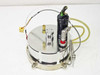 Top view of large stainless circular disc assembly with Clippard black pneumatic cylinder, red quick-disconnect fitting, and yellow thermocouple connector