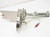 Side view of Clippard UDR-17 pneumatic cylinder on linear slide rail with stainless disc, red quick-disconnect fitting, and mounting bracket