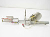 Full assembly side view showing Clippard cylinder on linear rail guide with stainless disc target, mounting hardware, and pneumatic tubing