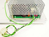 VMX SA10096-01 power supply close-up of base mounting plate showing stamped part number SM20037-01 B2 with green and white wiring