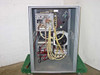 ISR Spraycool interior view — full open cabinet showing wiring harness, fluid tubing runs, heat exchanger, and internal components