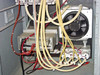 ISR Spraycool interior lower section — large axial cooling fan, fluid pump assembly, and bundled tubing runs