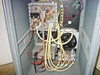ISR Spraycool interior side view — spray module enclosure, pump, fan assembly, and wiring harness from alternate angle