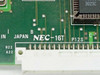NEC NEC-16T model designation and P12S marking close-up on PCB silkscreen, Made in Japan label visible
