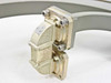 Close-up of WR-62 waveguide flange end showing brass/gold hardware, mounting screws, and articulating connector section