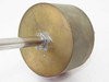 Micro Weld A554 large brass cylindrical end cap showing solder or epoxy seal around shaft entry point
