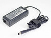 HP 463552-004 N193 18.5V 65W laptop AC adapter — top/front view showing HP logo label, DC output barrel cable coiled with Velcro tie