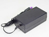HP 0950-4476 printer power adapter — side and rear three-quarter view showing IEC C14 AC input end and cable routing