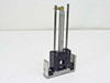 Bimba LT-025-D pneumatic cylinder assembly – side profile view showing dual shafts retracted and base plate mount