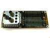 DEC small QBus I/O module – showing four BNC-style connectors and edge-connector fingers, P/N 07989-6934 visible