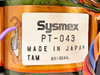 Close-up of Sysmex PT-043 label reading PT-043, Made in Japan, TAM, date code 9316046