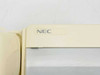 NEC ETJ-1HM-1 (SW) top corner close-up showing NEC logo and yellowed cream plastic housing
