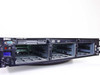 Dell PowerEdge 2850 front view with cover removed showing four empty hard drive bays and DVD-ROM drive