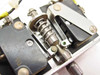 Micro Switch 9125 4AC2 internal mechanism close-up — spring plunger assembly, roller actuator, and sub-switch mounting detail