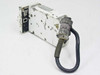 Traid Corp 1000-B 16mm Camera – rear/side view showing heavily worn white painted housing and MIL-spec circular connector with cable