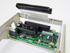 Premier 118-027475 caddy interior — close-up of 80-pin SCSI connector, interposer PCB with ICs and ribbon cable