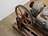 Rear view of GE variable speed motor showing large spoked output handwheel pulley with belt and support bracket on pallet