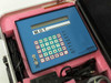 Bell Atlantic MDT tester front panel close-up showing LCD display, alphanumeric keypad with F1-F7 function keys, hex input buttons, wrist strap connector, and Bell Atlantic Computer Technology Services branding