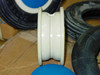 Side profile view of white plastic hub showing rim channel depth and split-hub construction