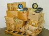 Cheng Shin SS201-02 mixed lot of tires, tubes, hubs and caps stacked on a wooden pallet in cardboard boxes