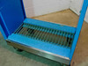 Wright Line cart — close-up of vented steel grate bottom shelf with caster base and brushed aluminum toe plate