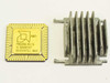 AMD R80286-16/S gold ceramic PGA 68-pin CPU top view showing AMD logo and Intel 1982 markings, with aluminum heat sink alongside